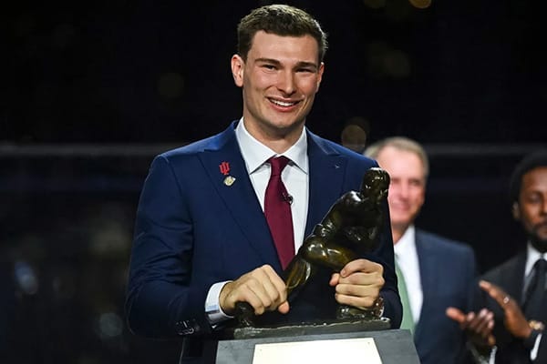 Fernando Mendoza holding Heisman Trophy after leading Indiana to National Championship