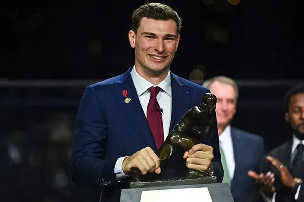 Fernando Mendoza holding Heisman Trophy after leading Indiana to National Championship