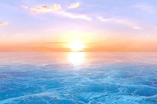 The Sunrise Principle: the sun rising over the ocean and lighting up the clouds